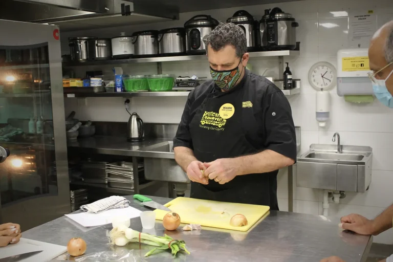 Team members in our Australia office try “Cooking for a Cause” with OzHarvest Sydney.